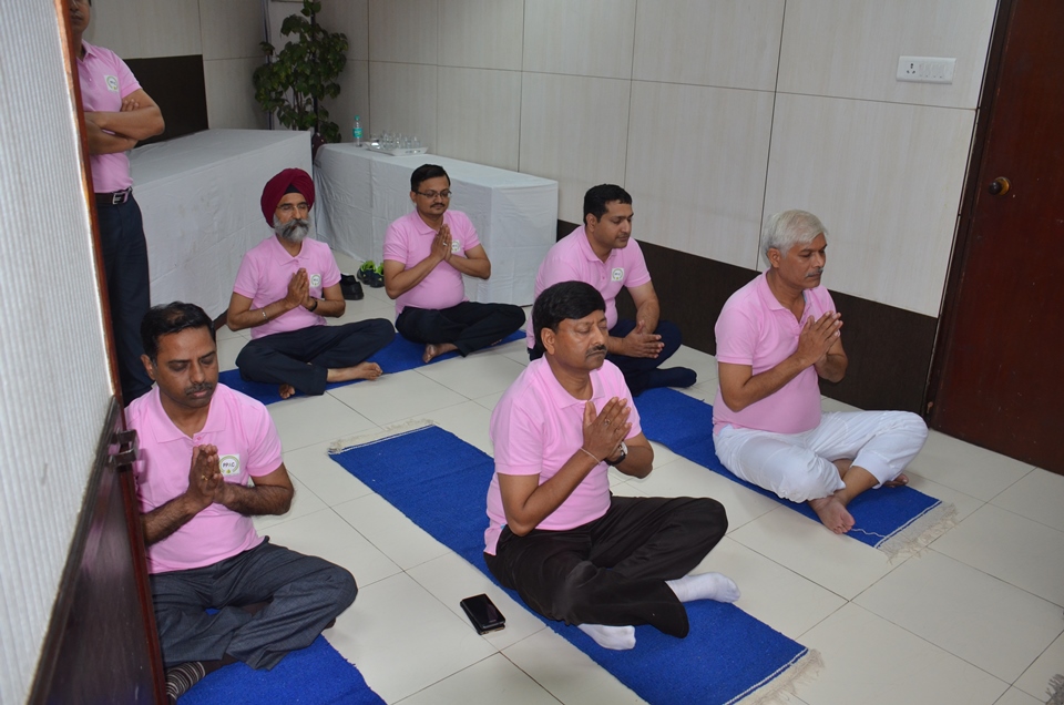 Employees of PPAC listening to Yoga Geet on International Yoga Day