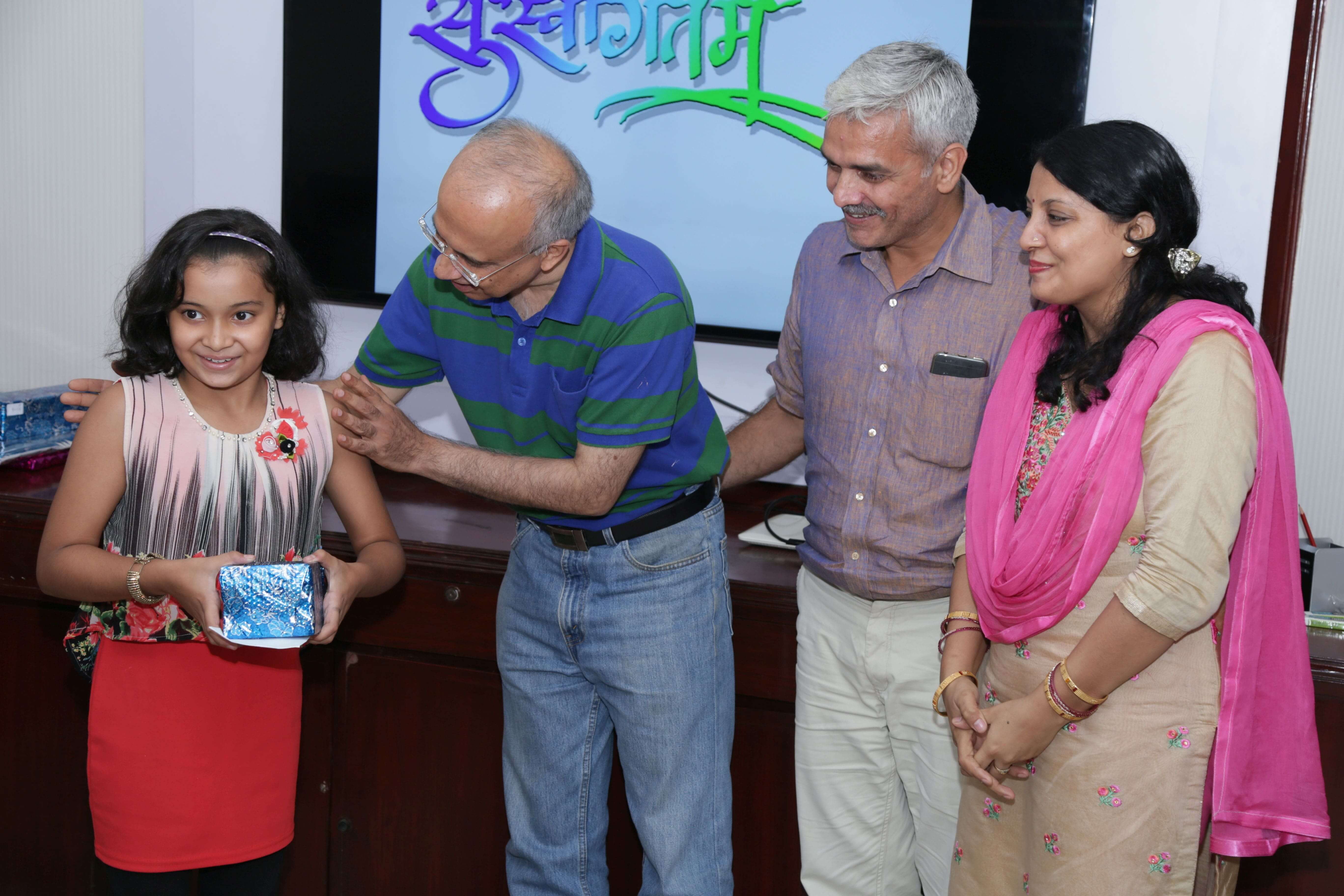 Prize distribution by Director Finance to children